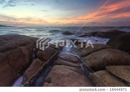 Beautiful sunset at the stone beach Beautiful sunset at the stone beach 18444971