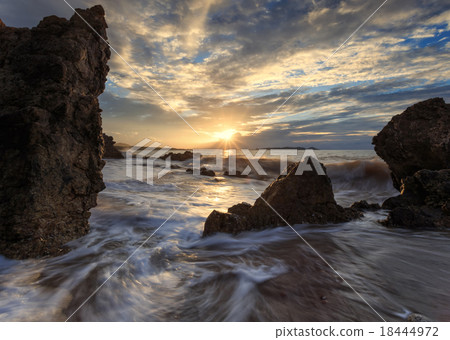 Beautiful sunset at the stone beach Beautiful sunset at the stone beach 18444972