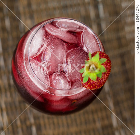 Strawberry lemonade with ice in glass on wooden  18445276