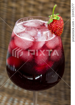 Strawberry lemonade with ice in glass on wooden 18445277