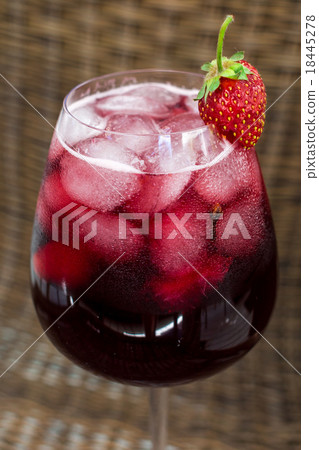 Strawberry lemonade with ice in glass on wooden 18445278