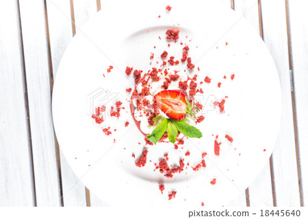 Delicious red cake with cream and berries close up 18445640