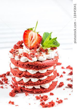 Delicious red cake with cream and berries close up 18445641