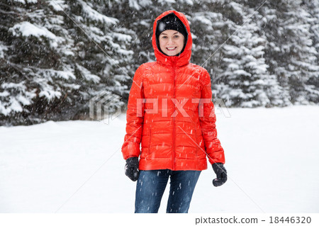 Pretty young woman playing snowballs Pretty young woman playing snowballs 18446320