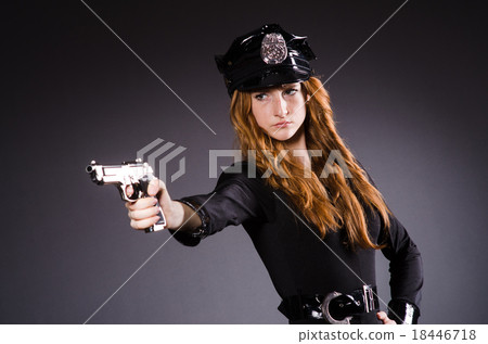 Stock Photo: Woman police office with gun