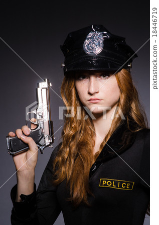 Stock Photo: Woman police office with gun