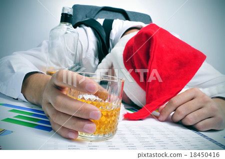 man sleeping in the office after a christmas party 18450416