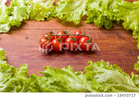 Fresh, ripe cherry tomatoes on an old wood Fresh, ripe cherry tomatoes on an old wood 18450717