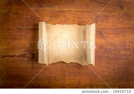 parchment scroll on wooden background parchment scroll on wooden background 18450718