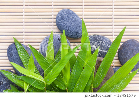 The Stones spa treatment scene on bamboo. 18451579