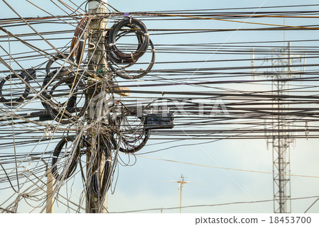 lot of wire cables messy on electricity pole  18453700