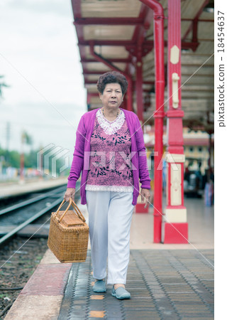 Mature vital elderly woman at the train station. 18454637