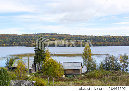 Rural houses on lakeside in taiga 18463592
