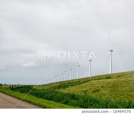 A row of wind turbines at the North Sea. 18464570
