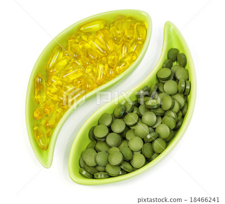 Fish oil capsules and organic spirulina tablets in 18466241