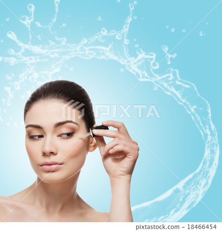 Girl applying serum Girl applying serum 18466454