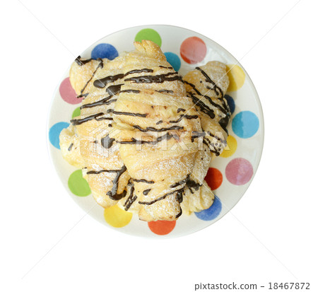 Chocolate croissants, isolated on a white plate 18467872