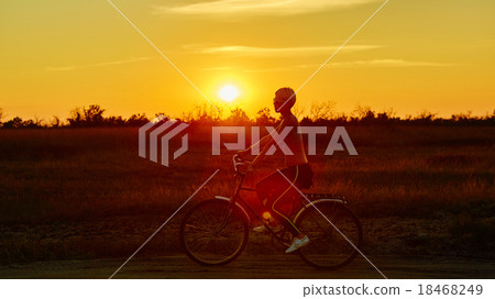 Biker-girl at the sunset 18468249