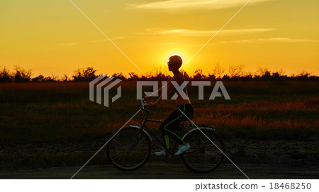 Biker-girl at the sunset 18468250