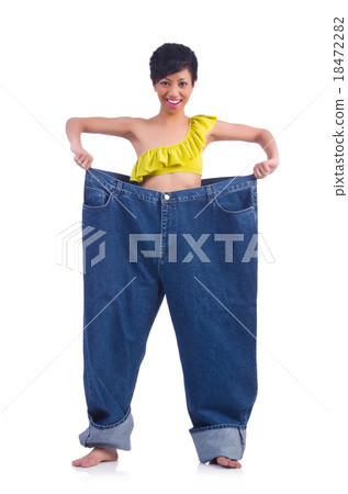Woman in dieting concept with big jeans Woman in dieting concept with big jeans 18472282