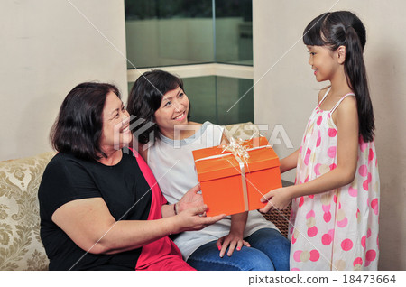 Grandma received present from her grand daughter 18473664