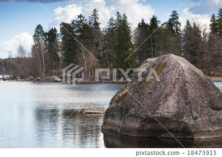 Still lake coastal landscape with stone in water Still lake coastal landscape with stone in water 18473915