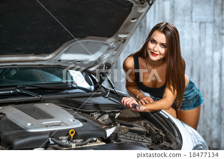 Concept for young sexy female car repair 18477134