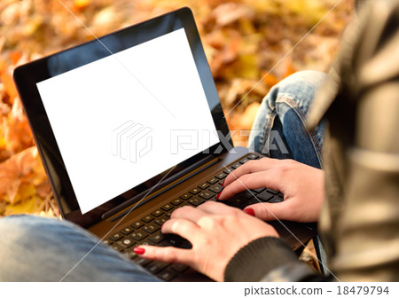 Woman in the park with laptop Woman in the park with laptop 18479794