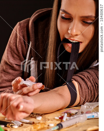 Female drug addict with syringe. Female drug addict with syringe. 18480637