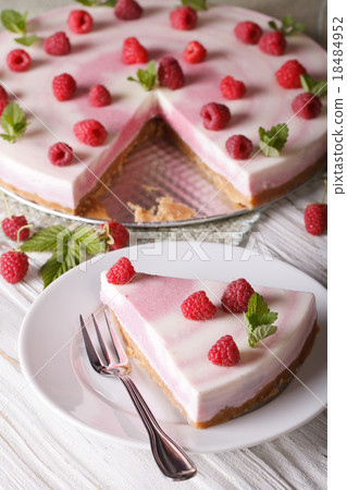 sweet cheesecake with raspberries and mint closeup sweet cheesecake with raspberries and mint closeup 18484952