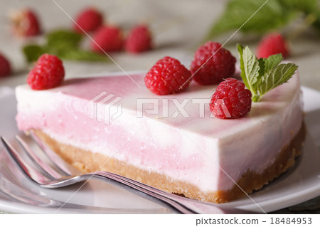 pink cheesecake with raspberries close-up on plate pink cheesecake with raspberries close-up on plate 18484953