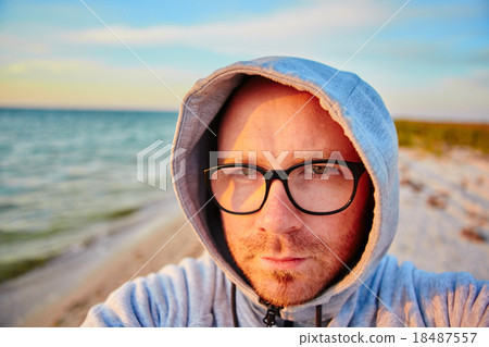 Handsome man making selfie  18487557