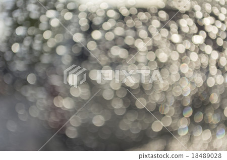 Abstract bokeh from raindrops on glass after rain 18489028