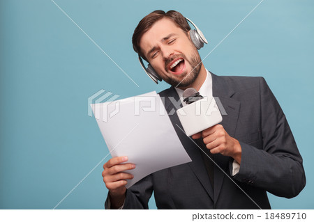 Attractive male reporter is making fun at studio 18489710
