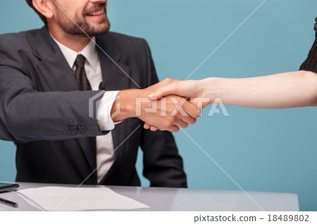 Professional young reporter is greeting his guest 18489802