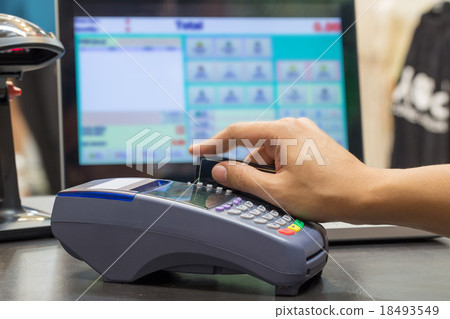 Hand Swiping Credit Card In Store 18493549