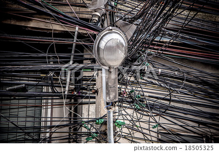 Lamp post on tangle of electrical Wires background Lamp post on tangle of electrical Wires background 18505325