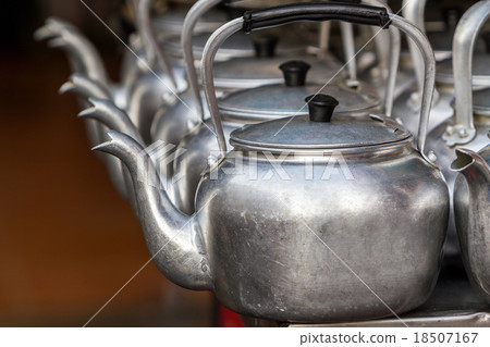 Small classic kettle in row. Small classic kettle in row. 18507167