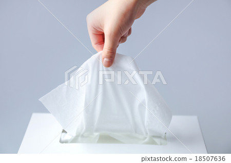 Hand holding tissue 18507636