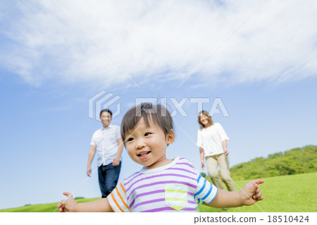 Three people walking in the park 18510424