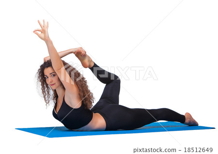 Studio shot of a young fit woman doing yoga 18512649