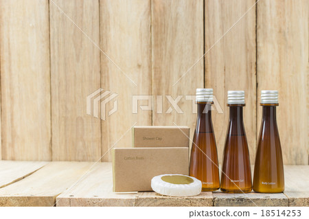 Tubes of bathroom amenity contains on wood 18514253