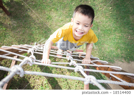 Little asian boy climbing rope obstacle Little asian boy climbing rope obstacle 18514400