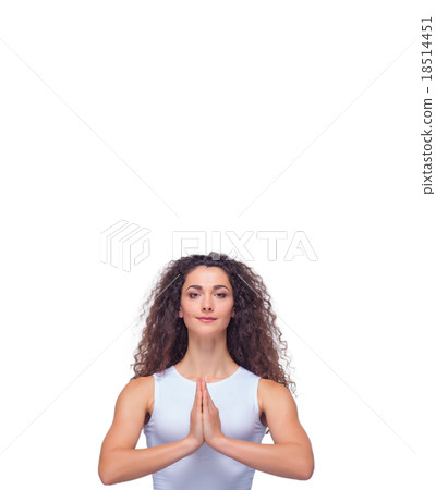 Studio shot of a young fit woman doing yoga Studio shot of a young fit woman doing yoga 18514451
