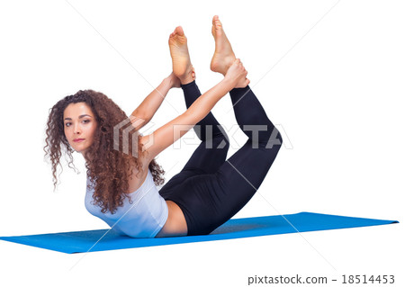 Studio shot of a young fit woman doing yoga 18514453