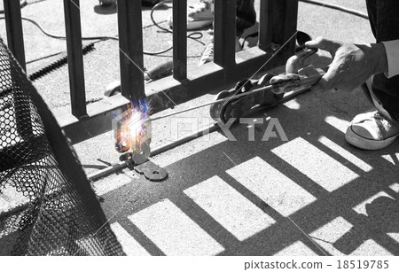 Welder making a fence roller 18519785