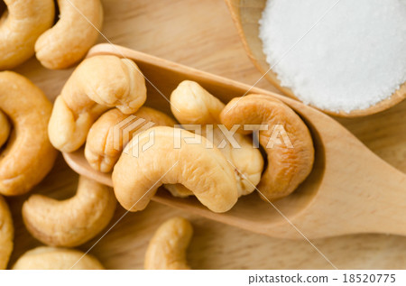 cashew and salt in wooden spoon. cashew and salt in wooden spoon. 18520775