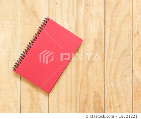 Top view of red book on wooden table Top view of red book on wooden table 18521221