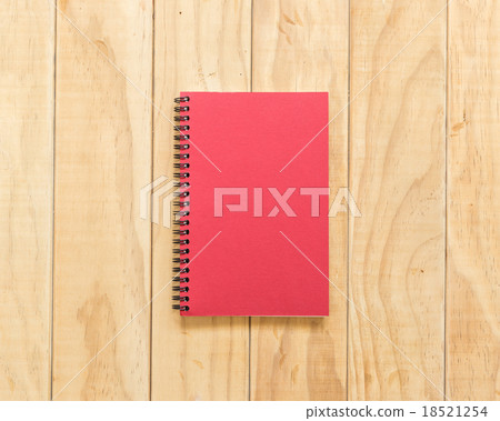 Top view of red book on wooden table 18521254