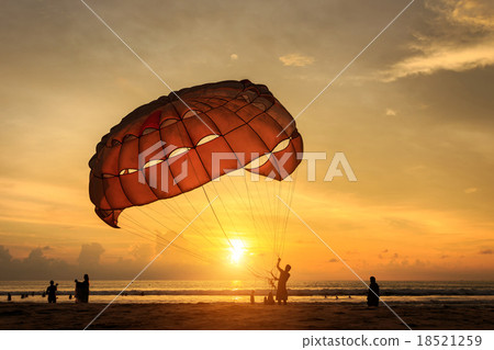 Man is preparing para sailing at the beach in Thailand Man is preparing para sailing at the beach in Thailand 18521259